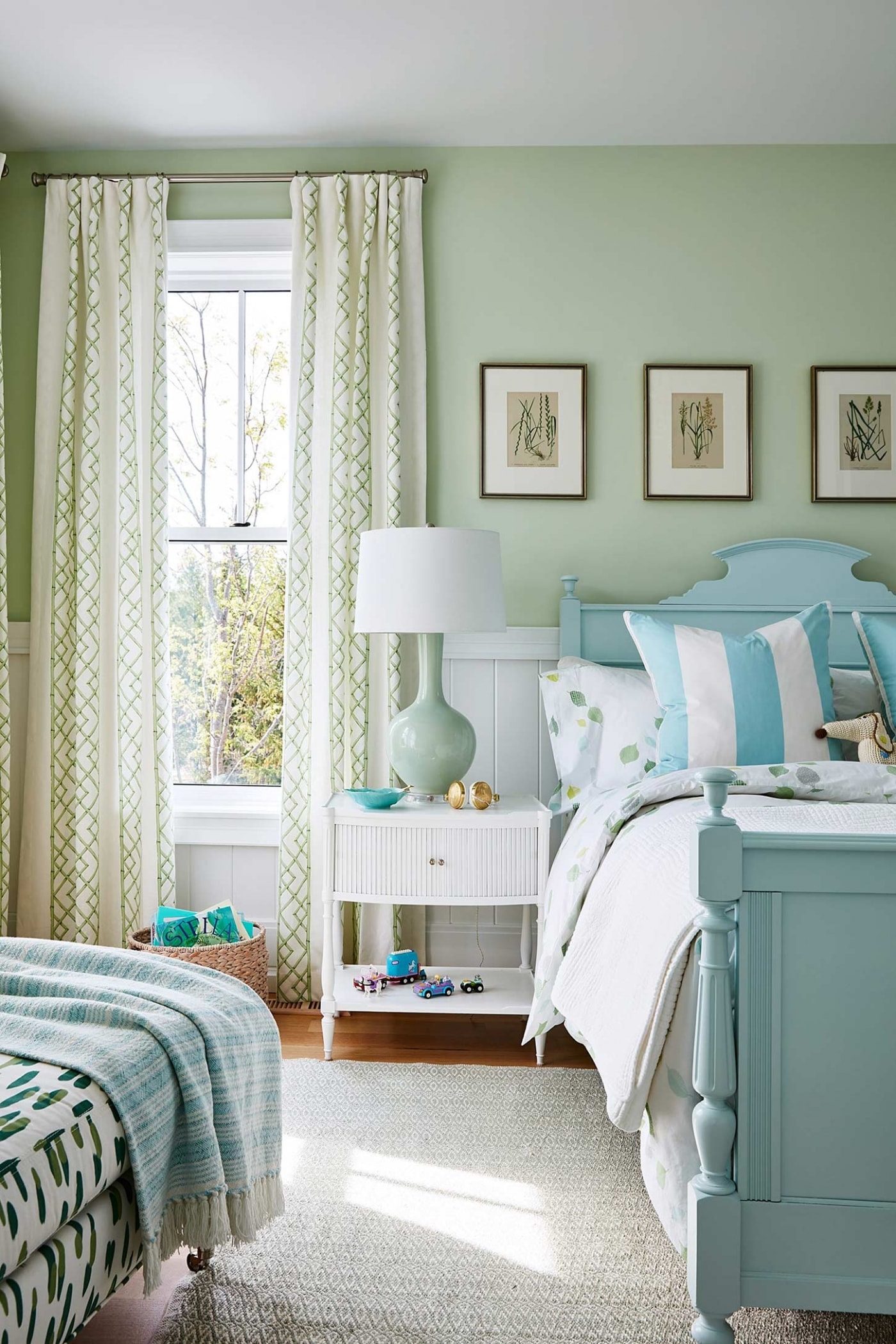 Sarah Richardson mint green bedroom with Tiffany blue cottage style bed, green walls, and white nightstand