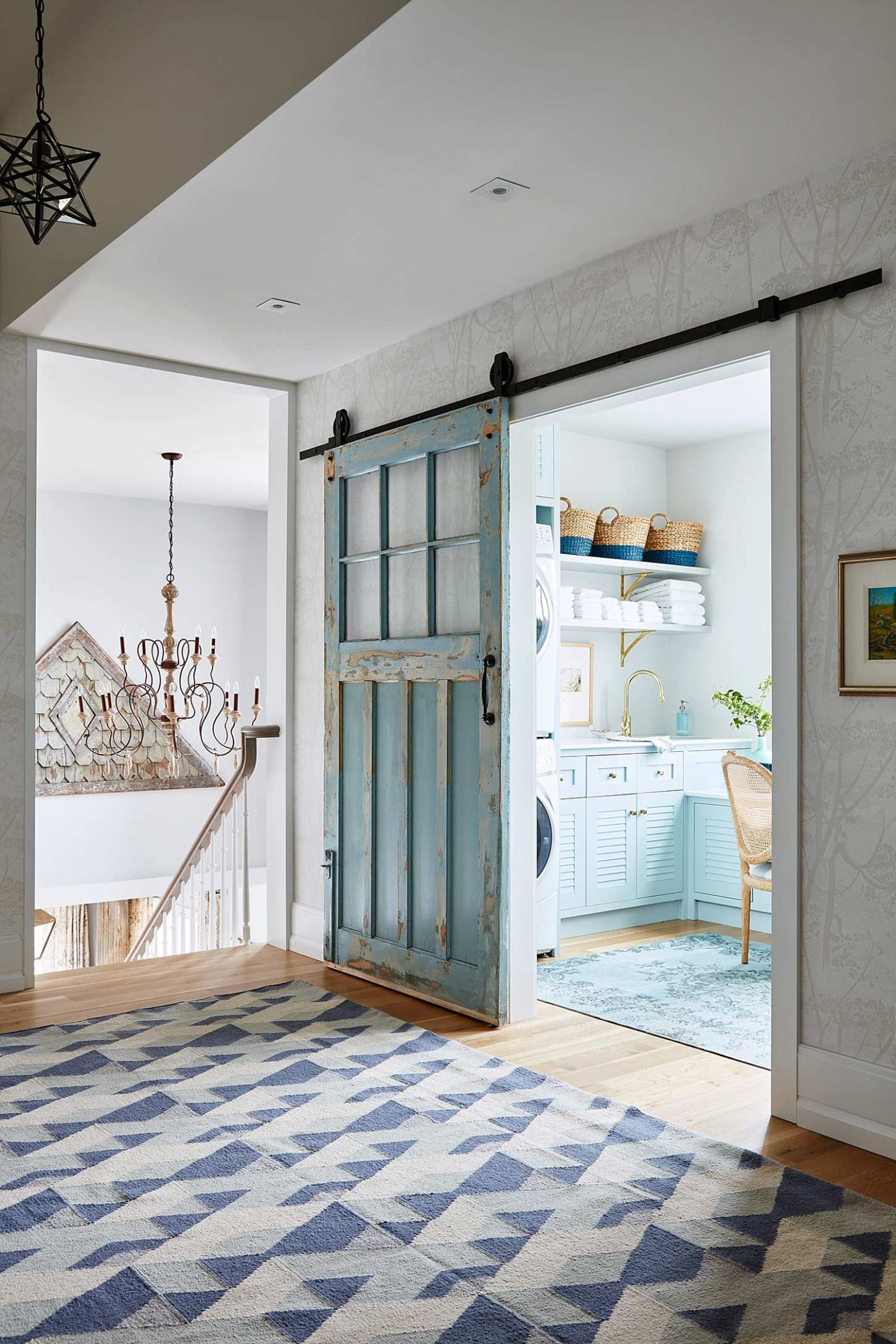 Turquoise blue vintage sliding barn door in #SarahRichardson gorgeous #farmhousestyle laundry room