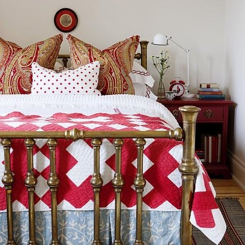 Guest Room Ready: Bed with red pattern bed sheet