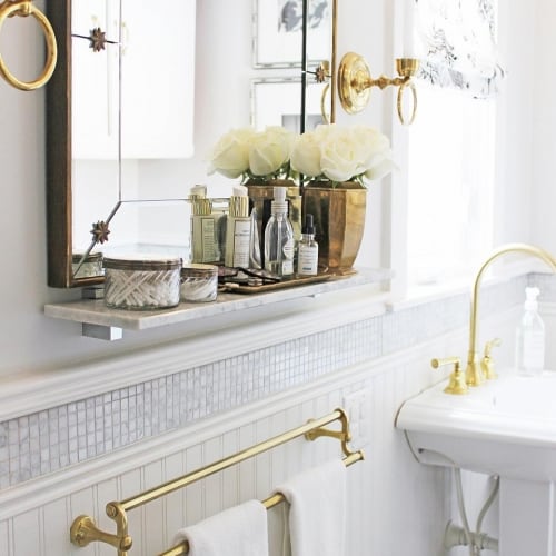 Full Bathroom featuring mirror and gold accents
