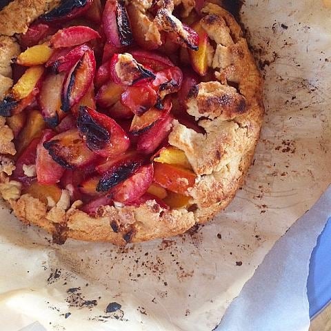 Picture of Plum Galette fresh out of the oven on parchment paper